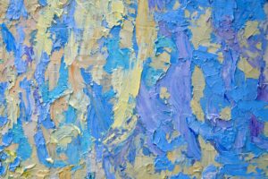 Abstract textured painting with blue and yellow strokes